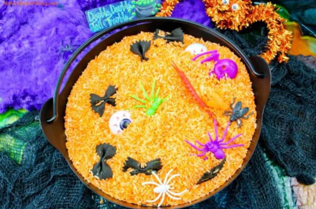 Orange witches brew with Halloween toys for kids