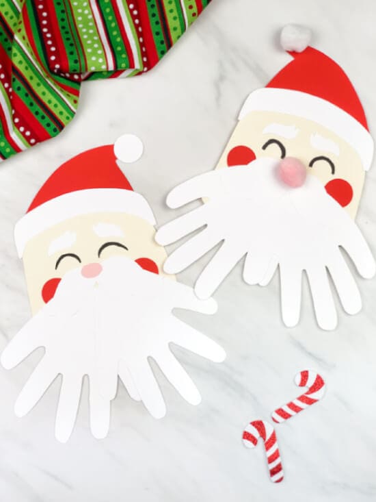 nopin="nopin" Christmas cards made with handprint featuring Santa