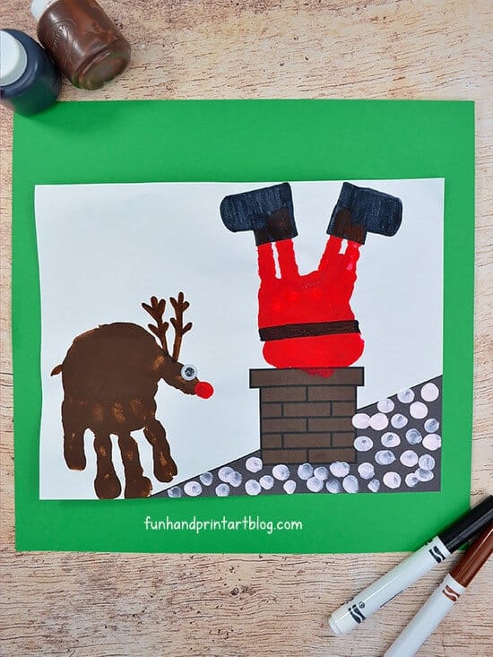 nopin="nopin" christmas card of stuck Santa in chimney featuring a handprint reindeer