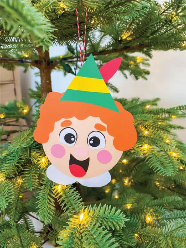 nopin="nopin" buddy the elf ornament made with printable hanging from Christmas tree