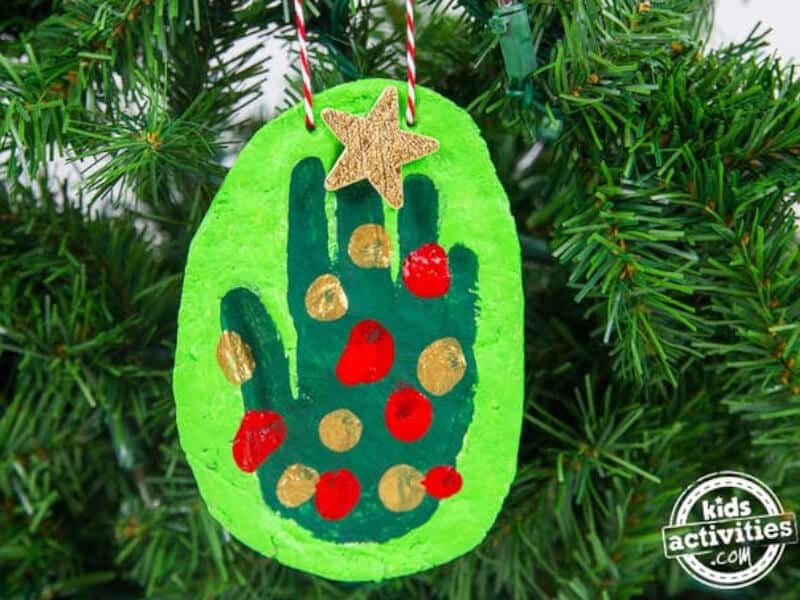 nopin="nopin" DIY salt dough handprint ornament hanging from Christmas tree