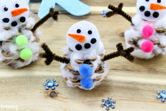 nopin="nopin" snowmen made with pine cones and pom poms