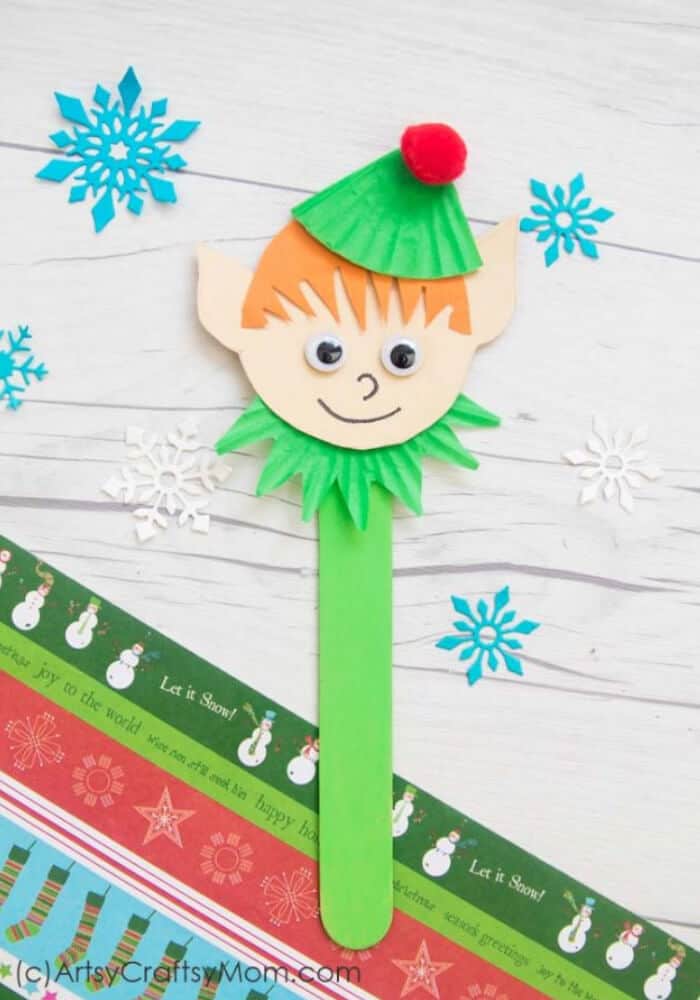 nopin="nopin" Christmas craft idea for kids featuring elf popsicle stick puppet