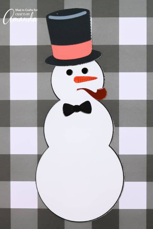 nopin="nopin" snowman with pipe on its mouth on a black and white checkered backdrop