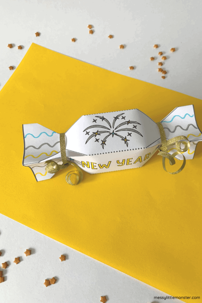 party crackers paper crafts featuring a yellow and white backdrop and sparkly confetti